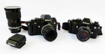 A Nikon F3 camera with Nikkor 50mm lens and another Nikon F3 camera with Nikkor 55mm lens, Nikon