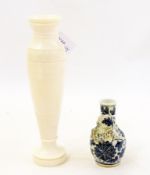 Carved and turned ivory vase with bands of reeded decoration and a Chinese blue and white pottery