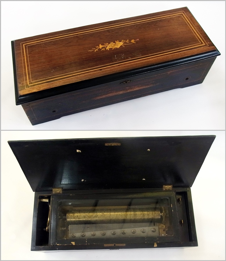 A late 19th century/early 20th century cylinder musical box, having 33cm brass cylinder and steel