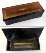 A late 19th century/early 20th century cylinder musical box, having 33cm brass cylinder and steel