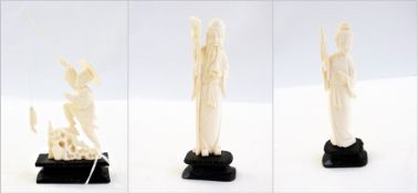 Two oriental carved ivory figures, one of lady carrying flag, the other of wise man with staff, each