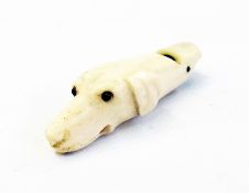 A Victorian bone whistle, in the shape of a dog's head    Condition Report  Please contact the