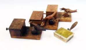 Three wooden carved cigarette dispensers decorated with birds and flowers and another    Condition