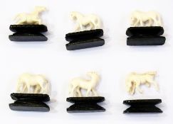 A set of six Chinese ivory model horses, on stands, along with one other stand (1 box)