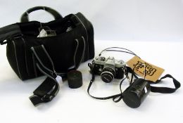 Canon FT camera with Canon 50mm lens, Canon lens FL35mm in case, a Canon Soligor auto tele-convertor