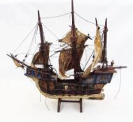 A wooden model of the Santa Maria, on stand (af)    Condition Report  Please contact the