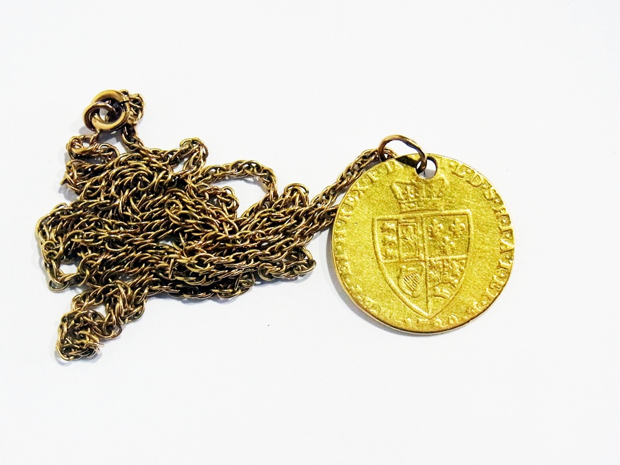 A 1789 spade Guinea pendant on Prince of Wales gold chain