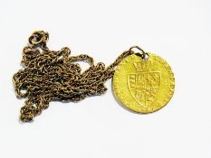 A 1789 spade Guinea pendant on Prince of Wales gold chain