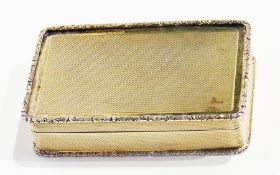 A 1930's silver gilt rectangular snuff box, with foliate relief border, engine-turned decoration,