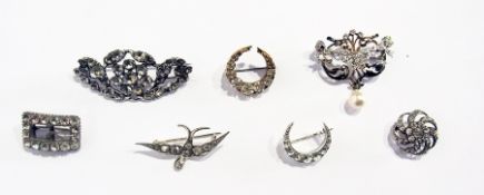 Seven diamante and paste stone set brooches including crescent, bird and others