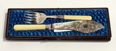 A pair of silver plate fish servers, knife and fork, with ivory handles, in a fitted case