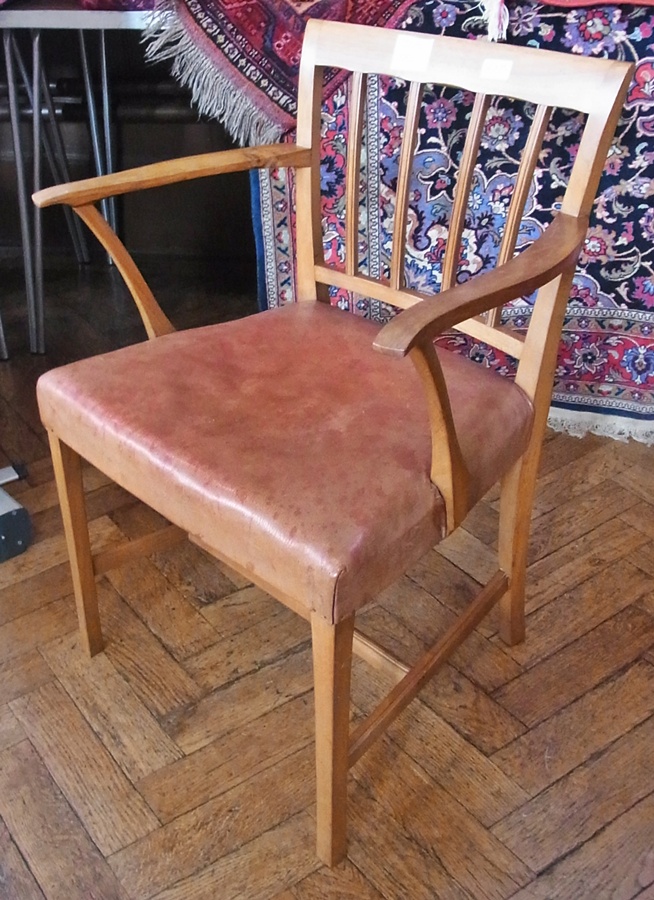 A walnut elbow chair by Kenneth Desmond Lampard, Cotswold School, with reeded back rails,