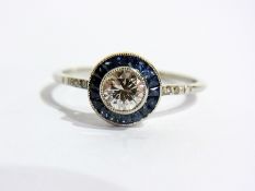 A 1920's style white gold diamond and sapphire ring, set circular diamond, 0.45ct approx. surrounded