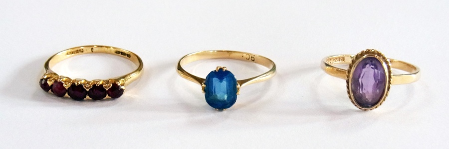 9ct gold ring with blue coloured stone, 9ct gold ring with purple coloured stone and another gold