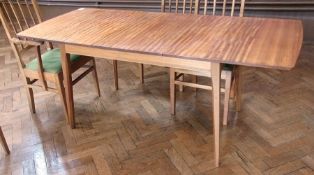 A walnut extending dining table, by Kenneth Desmond Lampard, Cotswold School, rectangular-shaped, on