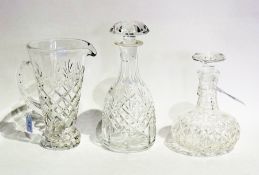 A cut-glass wine decanter and stopper, another, cut-glass claret jug and pointed facet-cut