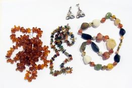 Two various polished stone necklaces, an amber-style necklace and a pair of silver pendant earrings
