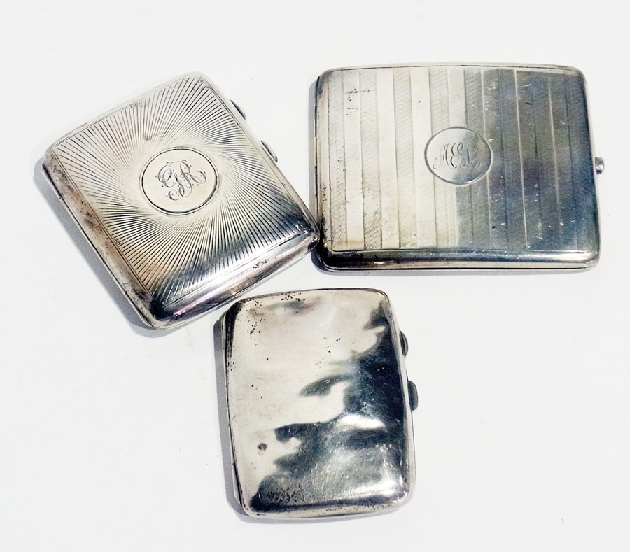 Three 20th century silver cigarette cases, various, 10 troy ozs approx.