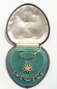 A Victorian Streeter & Co gold and pearl brooch pendant necklace set, the necklace with swags and