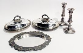 A pair of oval entree dishes with covers, a pair of candlesticks on square bases and bread board