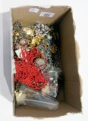 A quantity of costume jewellery to include:- 12 strand coral-effect necklace, brooches, buckles