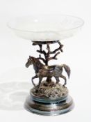 A cut glass bowl comport, raised on a silver plate naturalistic stand with horse on a circular base,