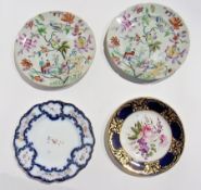 A pair 19th century ironstone china plates with chinoiserie figures and scrolling floral decoration,