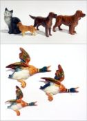 A Beswick red setter and another (with broken leg), Beswick golden retriever, cat and flying