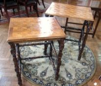 A nest of two veneered tables, with geometric pattern to top, on foliate supports, united by