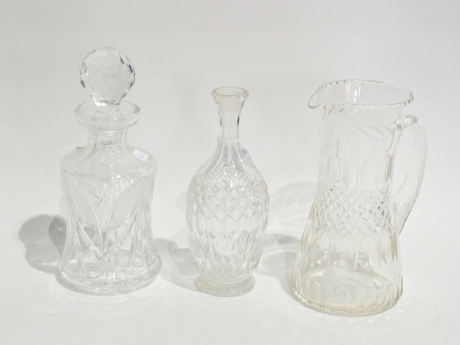 A cut-glass spirit decanter, waisted and the facet-cut stopper, cut-glass water jug, waisted, set of