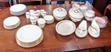 A Royal Doulton "Royal Gold" part dinner service, cream ground with gilt border