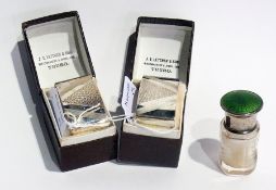 A pair of George V silver napkin rings, Art Deco design, Birmingham 1933, boxed, together with a