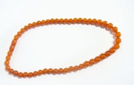 An amber-coloured bead necklace