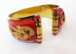 Gold and coral-coloured costume bangle with seahorse decoration