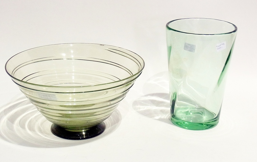 Mid 20th century green studio glass bowl, circular with flared sides, wrythen, 27cm diameter and a