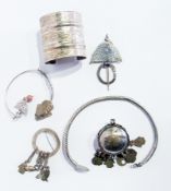 A Bedouin white metal cuff bracelet, white metal choker bracelet, two brooches, etc. (6)