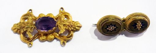 A Victorian gold-coloured and amethyst brooch set single oval stone and another double oval gold-