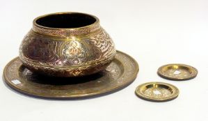 A quantity of Eastern engraved brassware with copper and silver-coloured embossing to include:- bowl