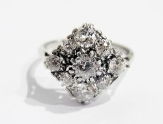 Platinum and diamond cluster ring, offset square set larger central diamond