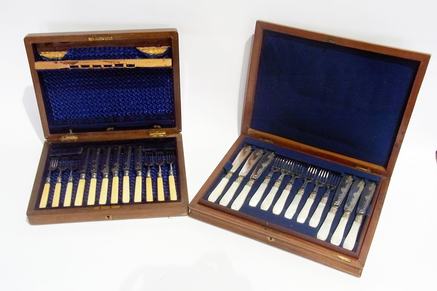A set of six of silver plate fish knives and forks, with carved mother-of-pearl handles, cased