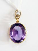 Gold coloured pendant with purple (paste ?) stone