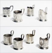 A small collection of Russian white metal commemorative tea glass holders, to include:- Leningrad,