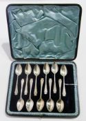 A set of eleven Victorian silver coffee spoons, Sheffield 1900, 11oz approx., in a fitted case