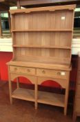 An oak dresser by Kenneth Desmond Lampard, Cotswold School, the three shelved top above a base