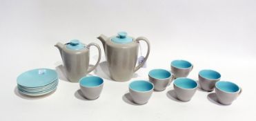 A 1950's Poole pottery coffee service, grey mottled with turquoise blue saucers and interiors to