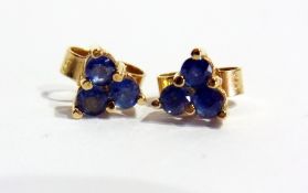 Pair of gold and sapphire stud earrings of three-stones