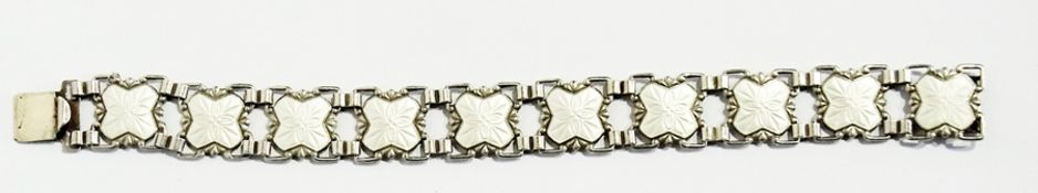 A Scandinavian-style silver and white enamel bracelet, floral decorated