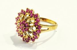 A 9ct gold, ruby and diamond cluster ring set multiple stones