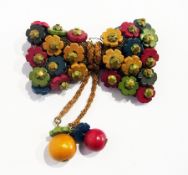 Miriam Haskell brooch, stained wood and mesh, bow-shaped with two tassels decorated with