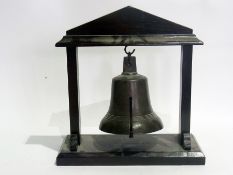 Brass hanging table bell on oak architectural style stand, 40cm high